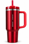 A red Stanley Starbucks insulated travel tumbler with a handle, matching red lid and straw, and a silver band near the lid, shown on a white background.